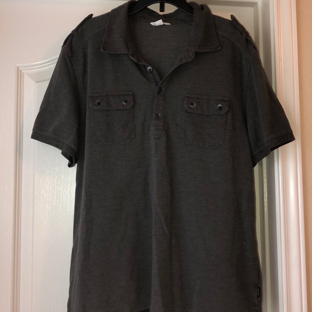 Dark grey men’s polo with pocket details on chest